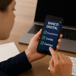 Mulher utilizando um aplicativo de banco digital em seu smartphone, com opções de 'Empréstimo', 'Contas' e 'Cartões' exibidas na tela. Ao fundo, sobre a mesa de madeira, há um notebook e um teclado, representando um ambiente de trabalho moderno e conectado. A imagem ilustra a praticidade e a inovação proporcionadas pelas fintechs, que oferecem soluções financeiras digitais acessíveis e eficientes para os usuários.